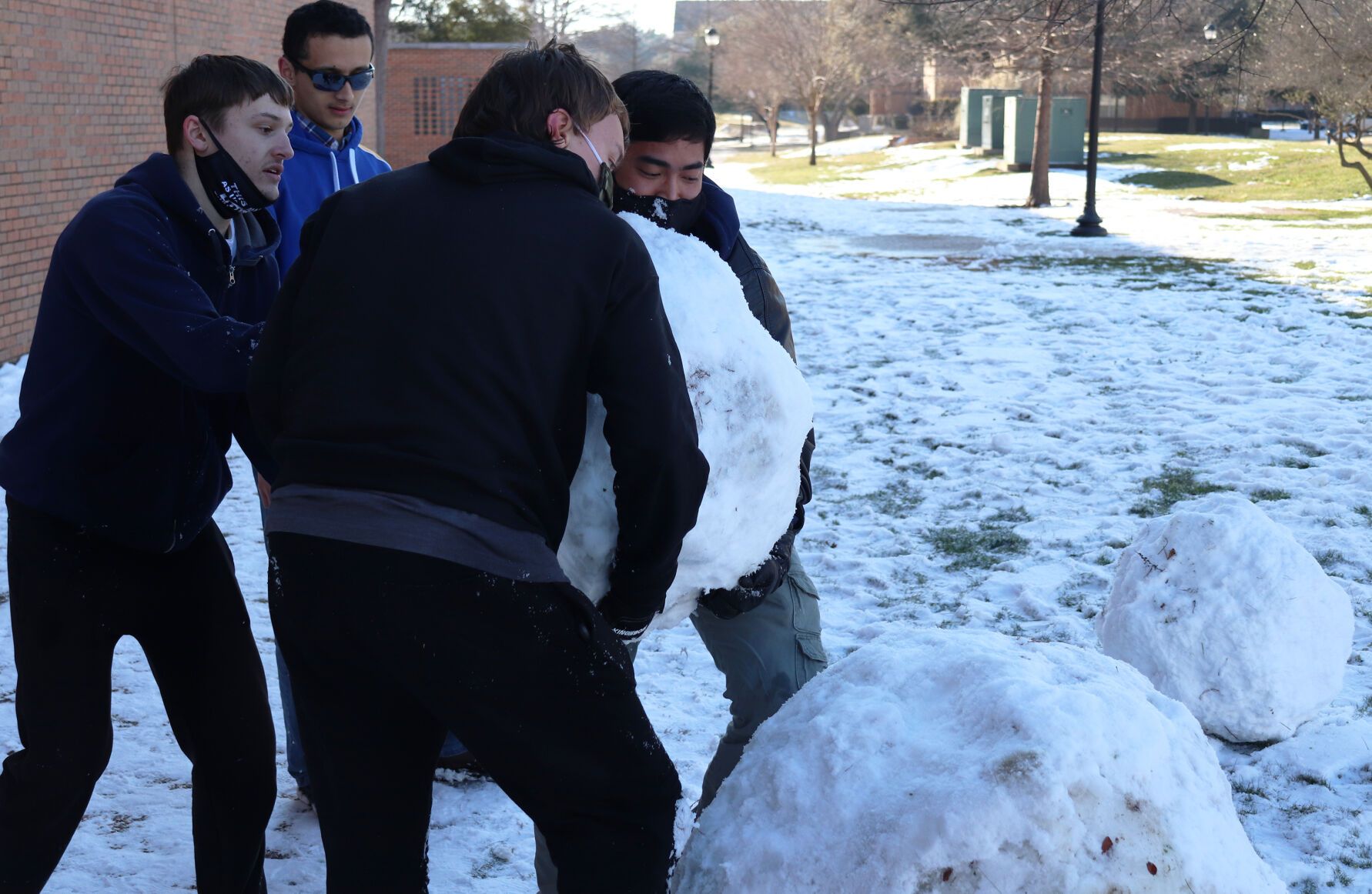 Photos: UTA students take advantage of the snowfall blanketing campus